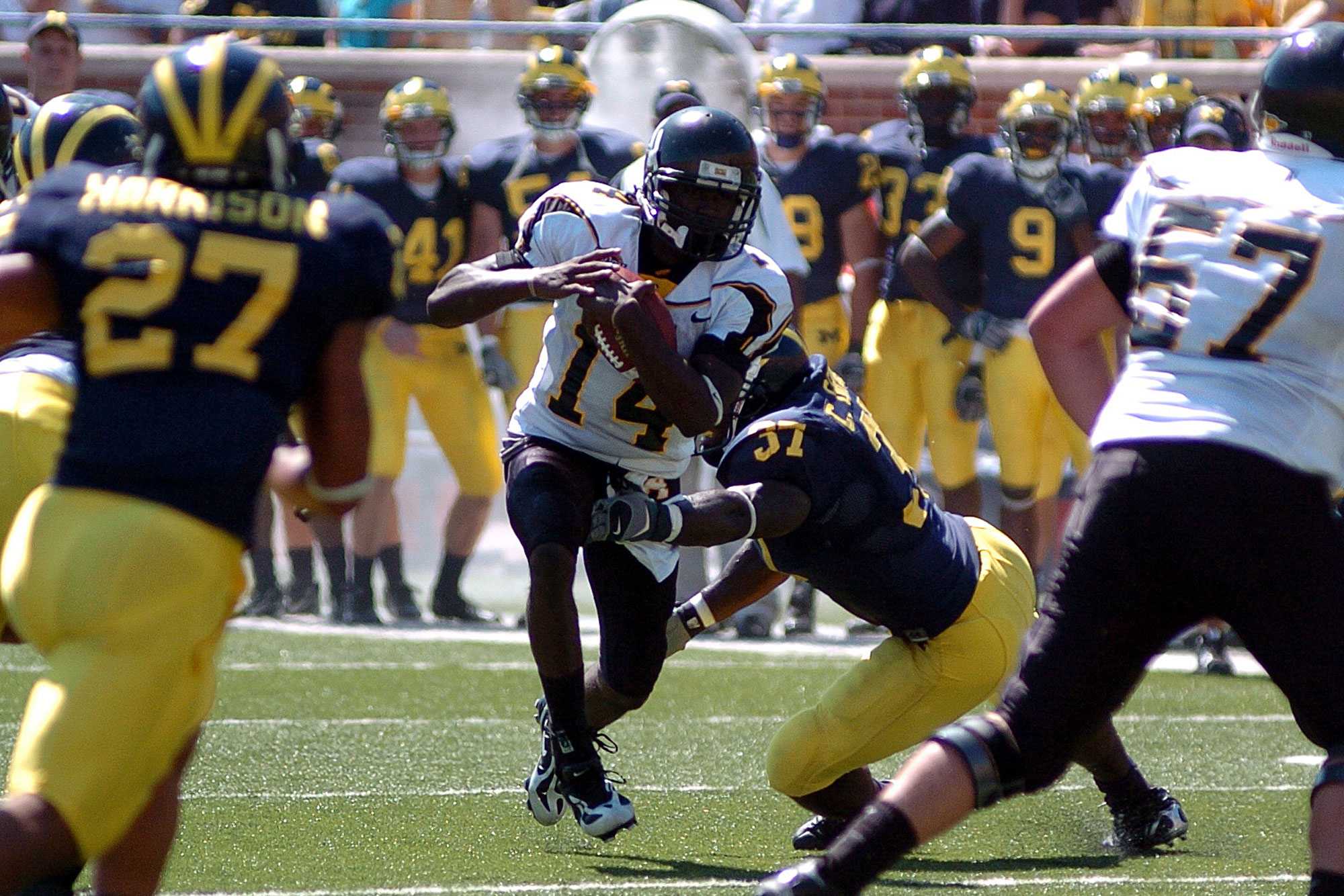 Sophomore quarterback Armanti Edwards attempts to rush the ball against Michigan defenders. 
Courtesy: App State Athletics 