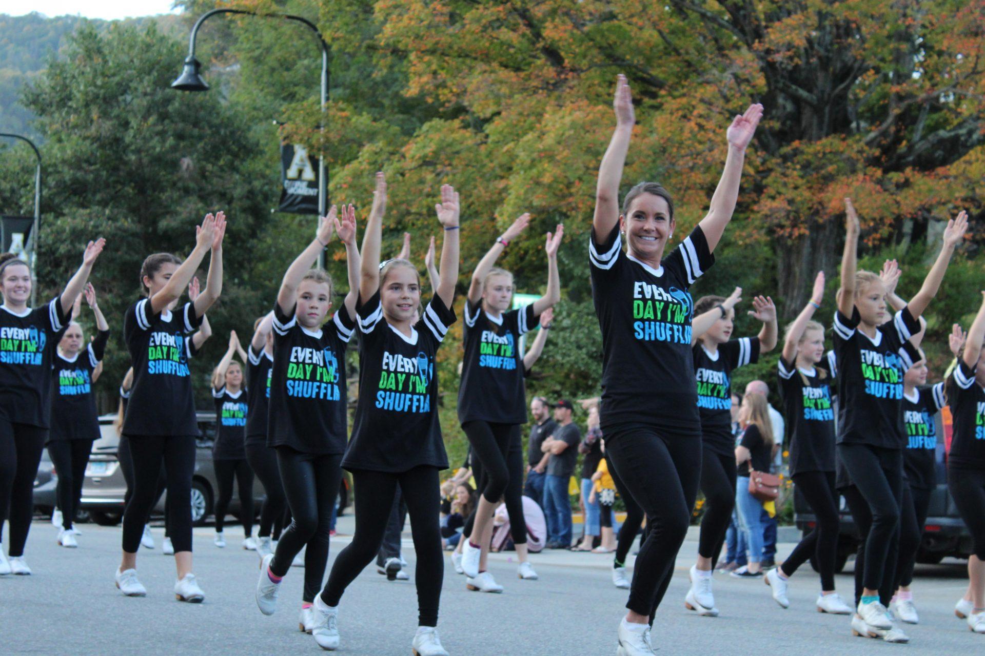 A local tap and clogging team dancing in Fridays homecoming parade.