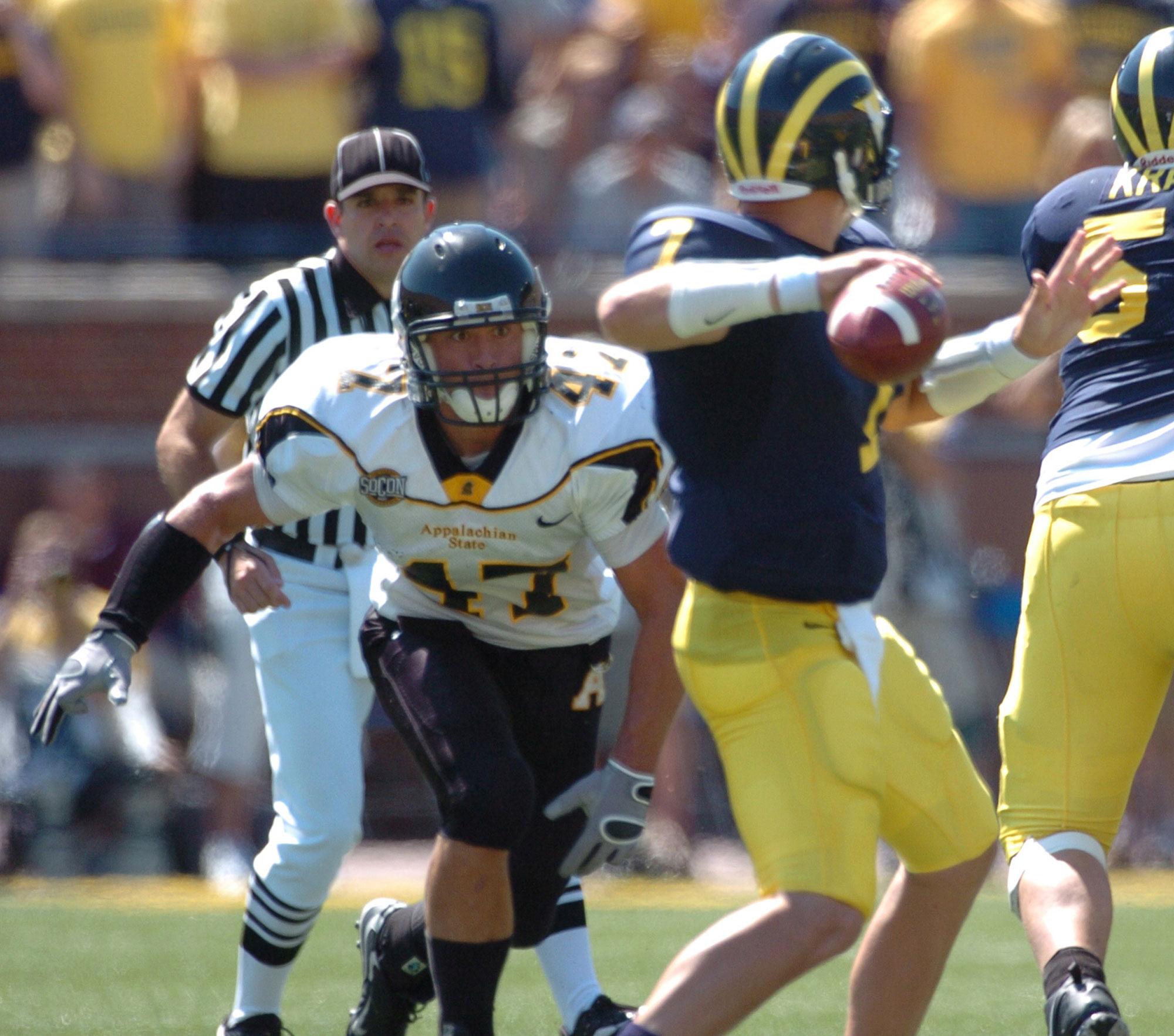 Senior defensive back Corey Lynch pressures Michigan quarterback Chad Henne during the App-Michigan game on September 1, 2007. 
Photo courtesy: App State athletics 