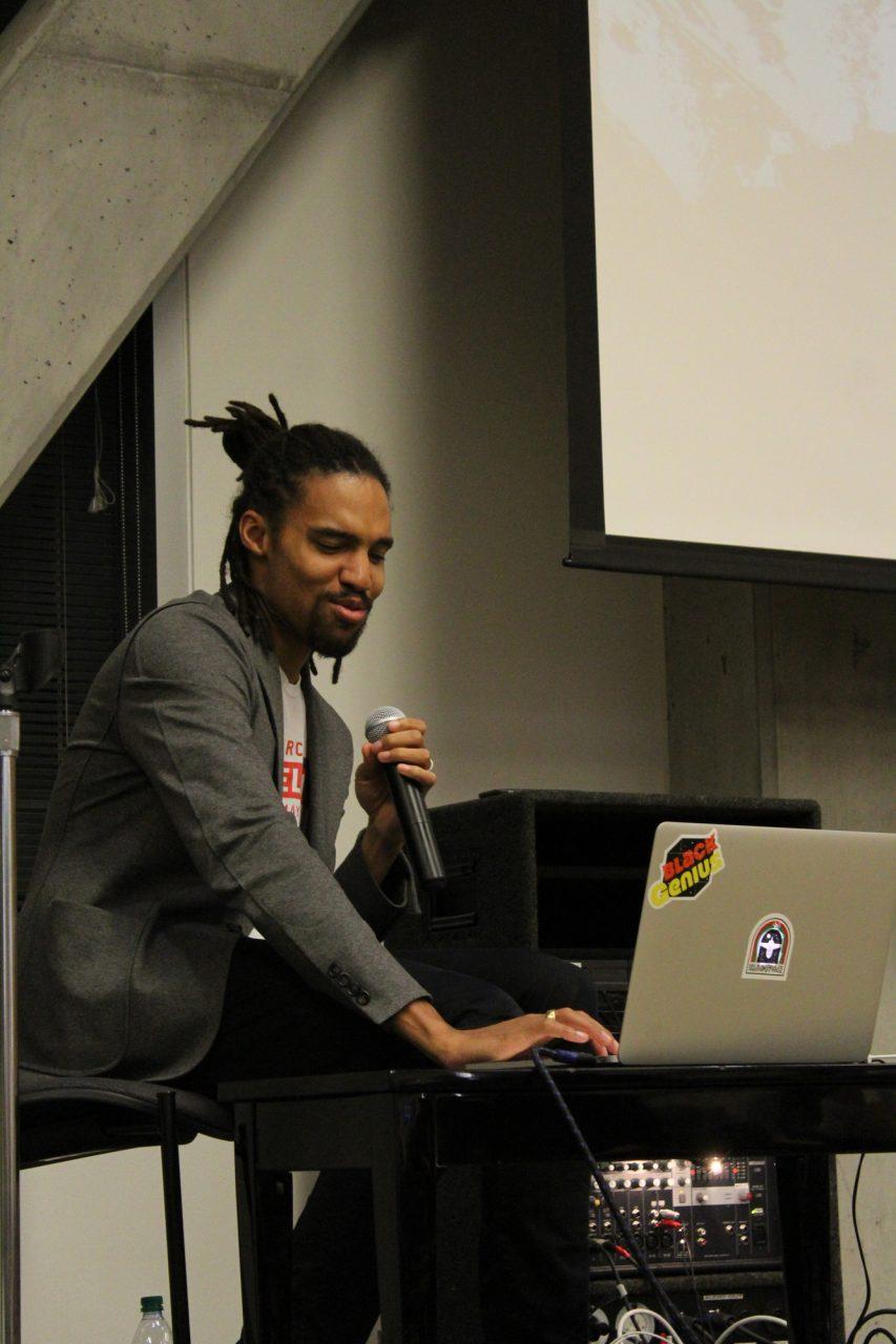 Pierce Freelon plays one of his favorite rap songs for an audience of Appalachian students. Freelon is a Durham-based rapper and activist that has travelled around Africa empowering young people through his music program known as Beat Making Labs.