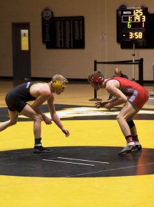 Freshman, Colby Smith during his match against Gardner-Webb opponent on January 24th. Photo credit: Halle Keighton, Photo Editor 