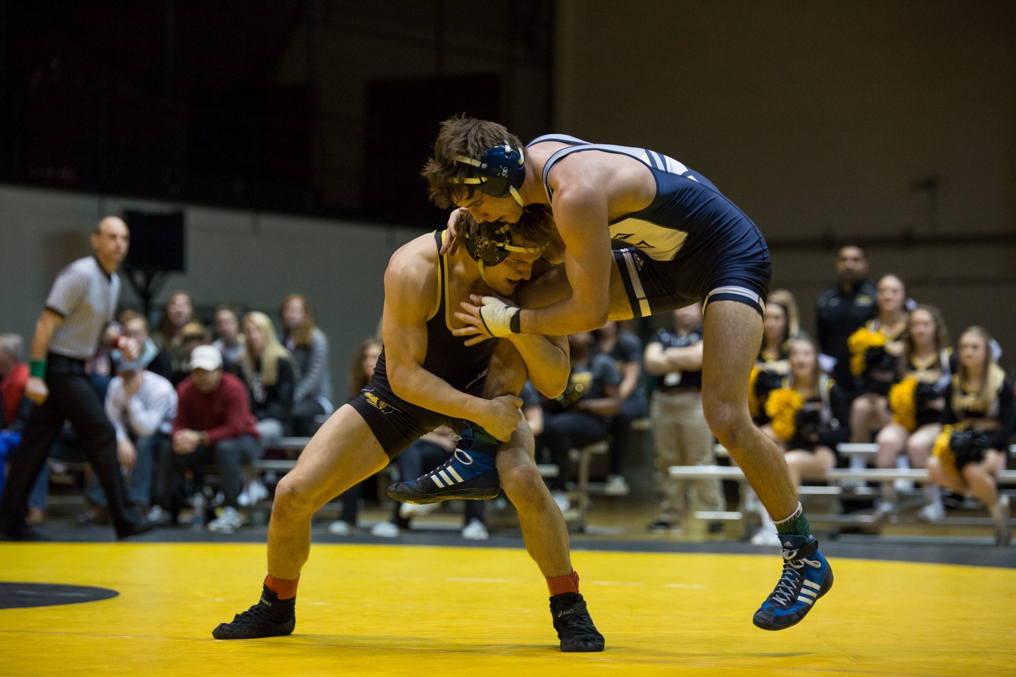 The Mountaineer’s Matt Zivistoski attempts to take down Chattanooga’s Roman Boylen. Following a 16-16 tie, the Mountaineers stayed undefeated in the SoCon with a 55-54 tiebreaker over the Mocs.