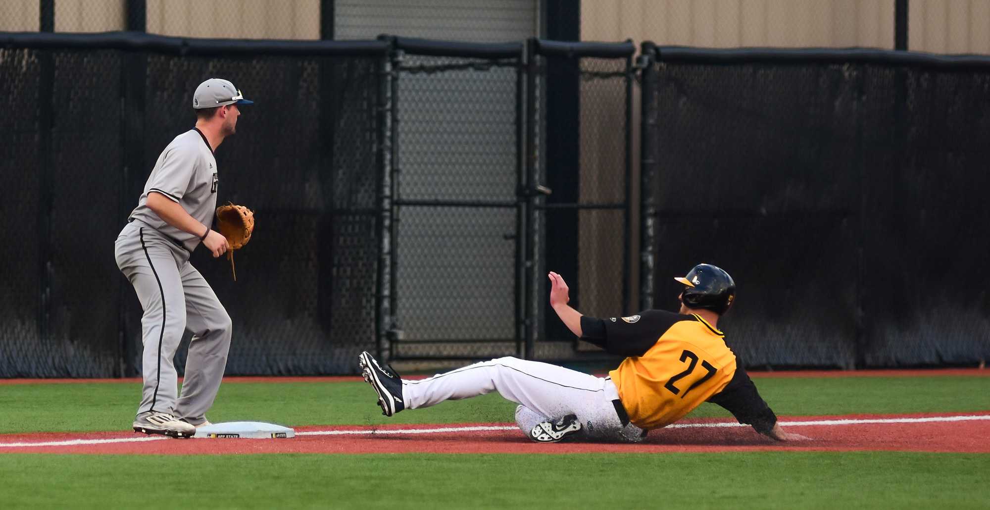 Senior infielder Grayson Atwood slides to third base. Photo by Dallas Linger, Photo Editor.