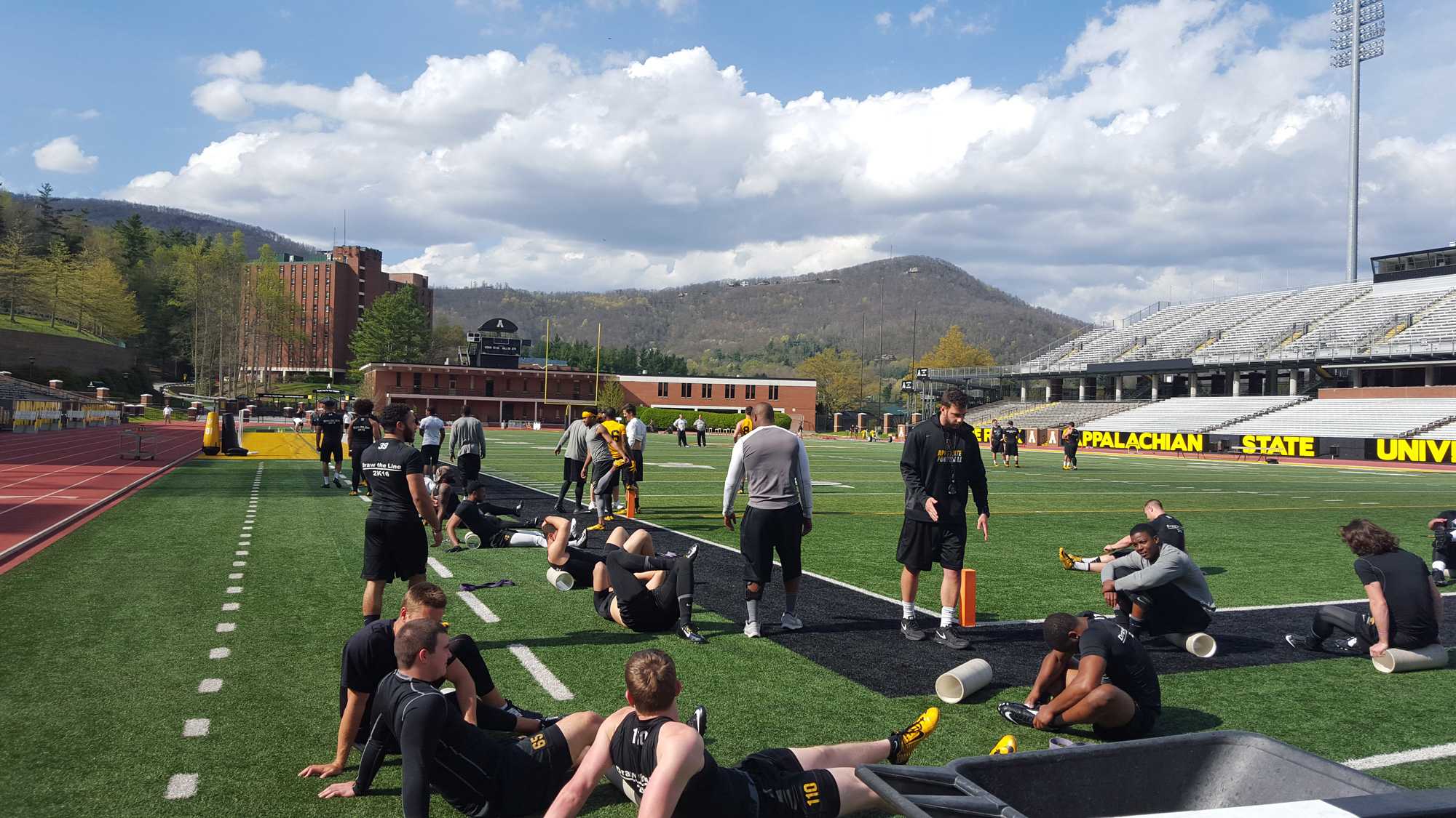 Members of the football team stretching before practice. Photo by Nick Joyner