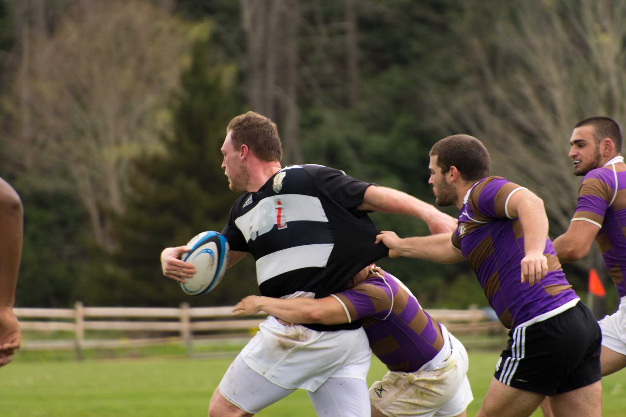 Senior prop Murphy Swancy attempts to run for a try against Western Carolina University on Saturday at State Farm. A try is the primary way of scoring and is worth five points. Photo by Dallas Linger.