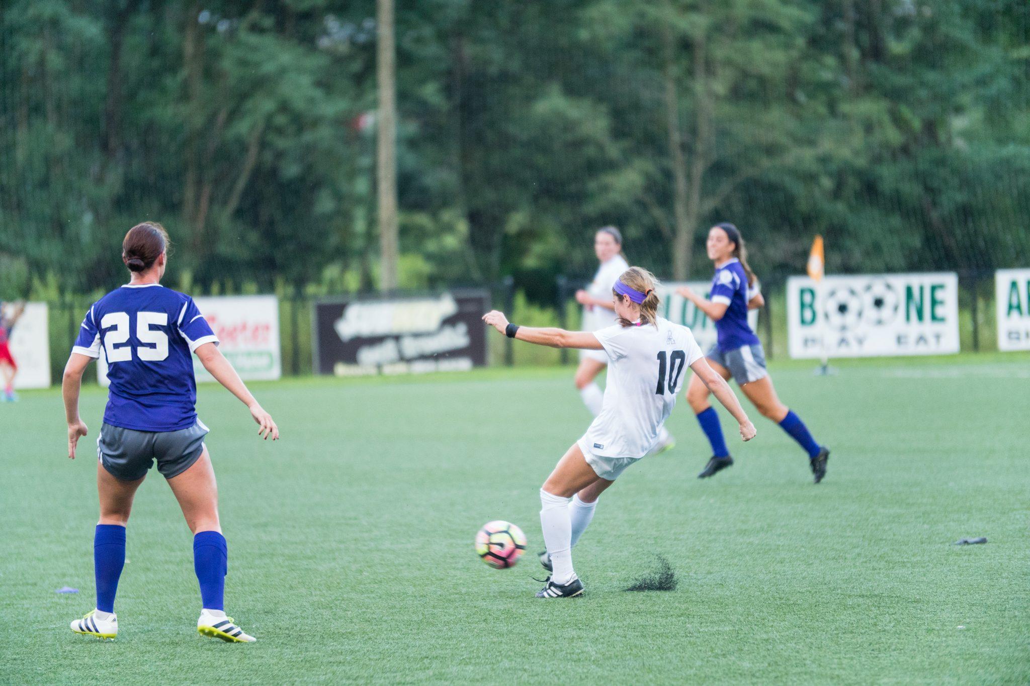 Senior Jane Cline fights for the ball in Thursday's game against Western Carolina. 
Photo By: Maleek Loyd