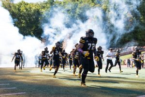 Senior defensive line Tyson Fernandez runs through the tunnel pregame against Georgia State on Oct. 1.