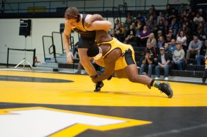 Denzel Dejournette keeps David Henry from Oregon State University on the defensive, taking him down mid-match.