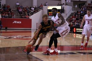 Guard Emarius Logan drives to the basket against the Wildcats. Logan finished with eight points 