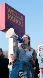 Protestors gathered at the Wells Fargo for over two hours, chanting, singing and spreading the word.