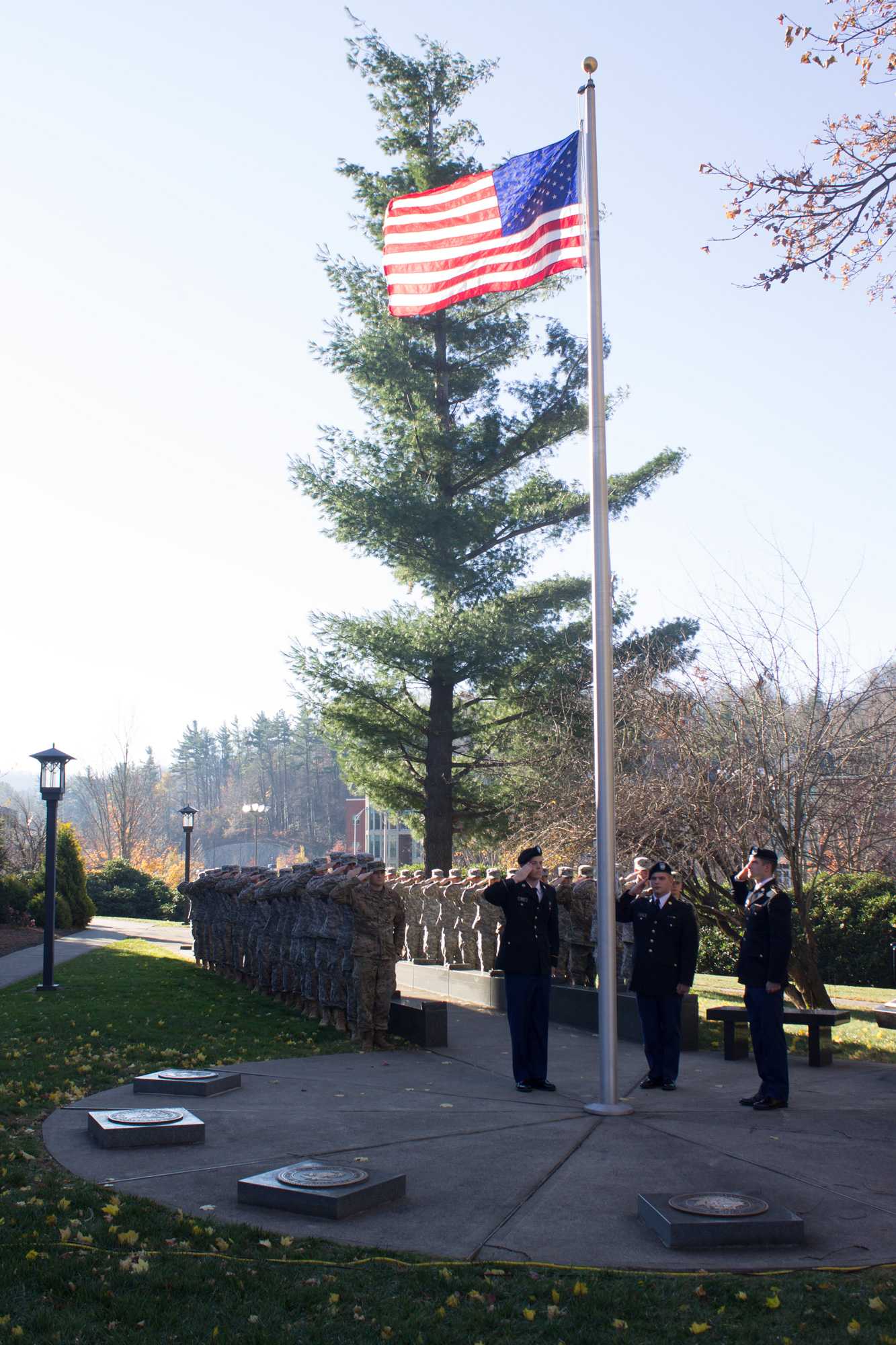 Cadets salute after the raising of the flag at the Veterans Day Ceremony on November 11 near B.B. Dougherty.