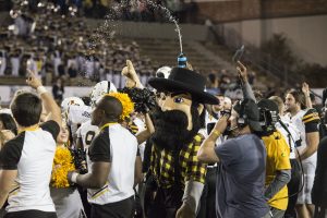 Fans celebrate after the bowl win. Photo credit: Halle Keighton