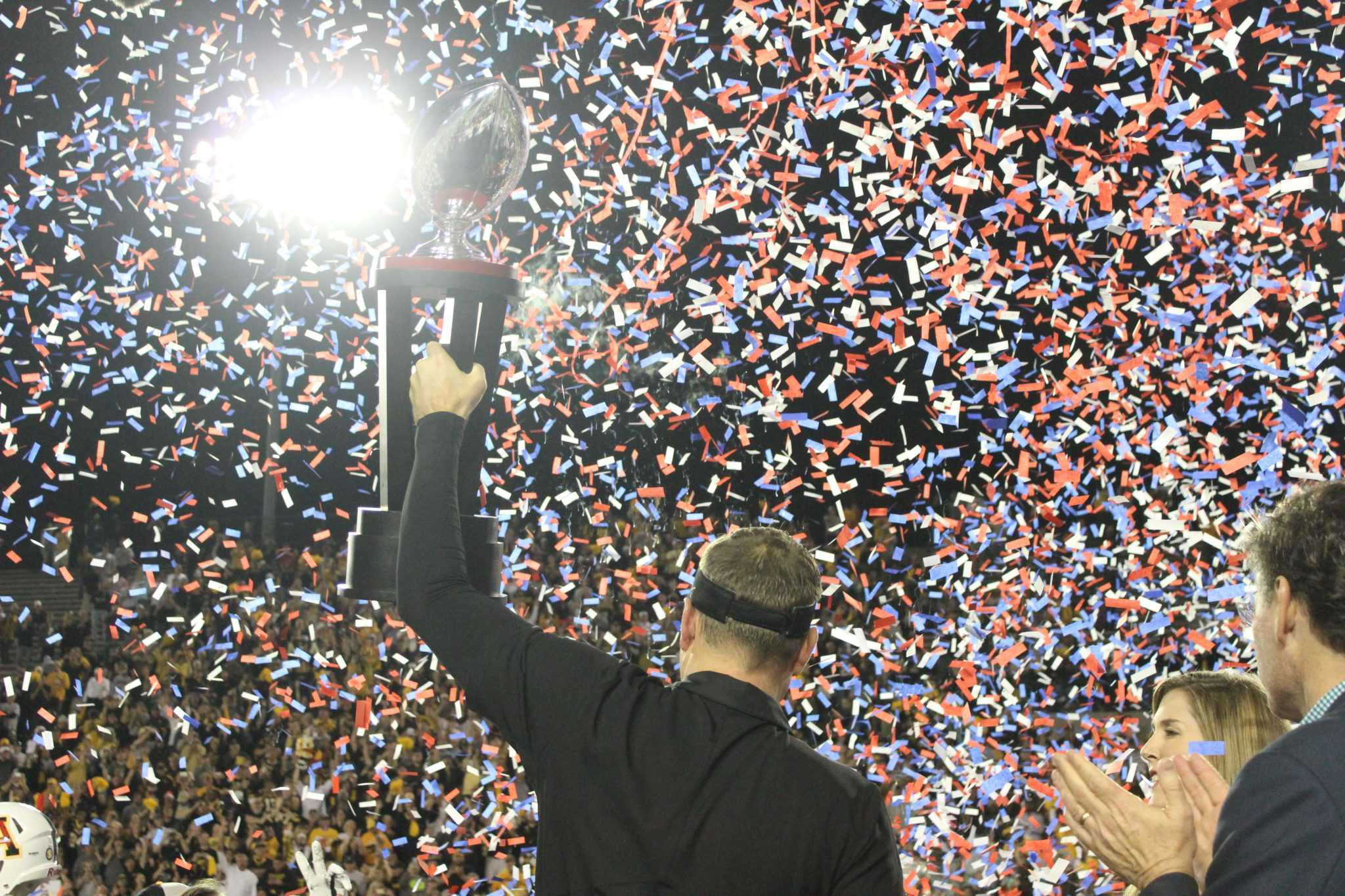 Scott Satterfield hoists the Camellia Bowl trophy for the second consecutive season.