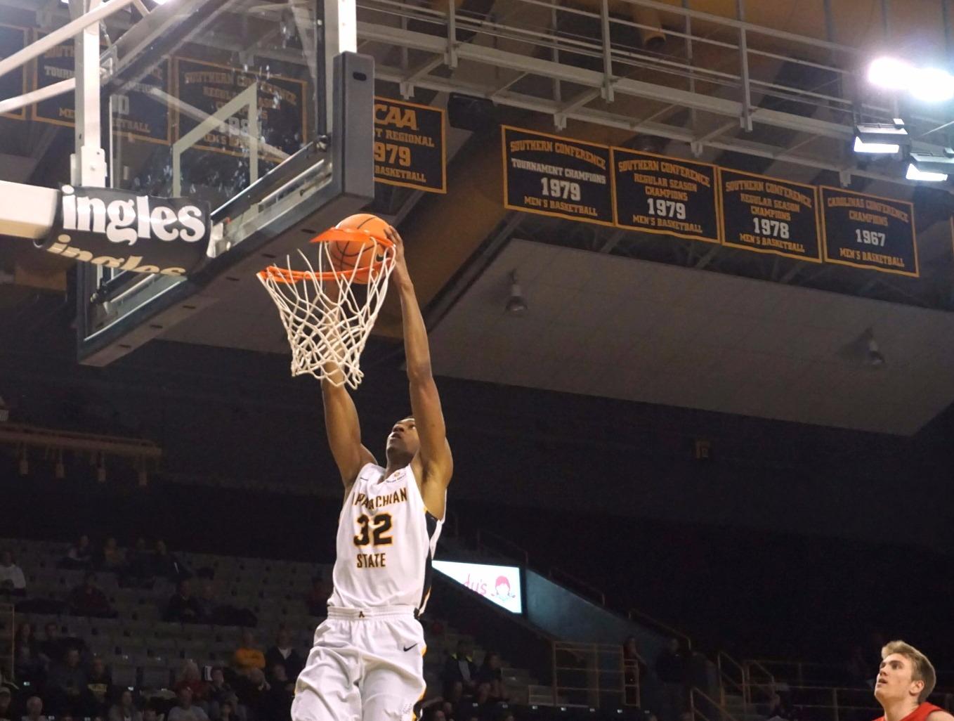 Tyrell Johnson going up for the two-handed slam after a steal 