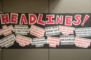 Headlines hung up in the Blue Ridge Ballroom for the Tunnel of Oppression. 