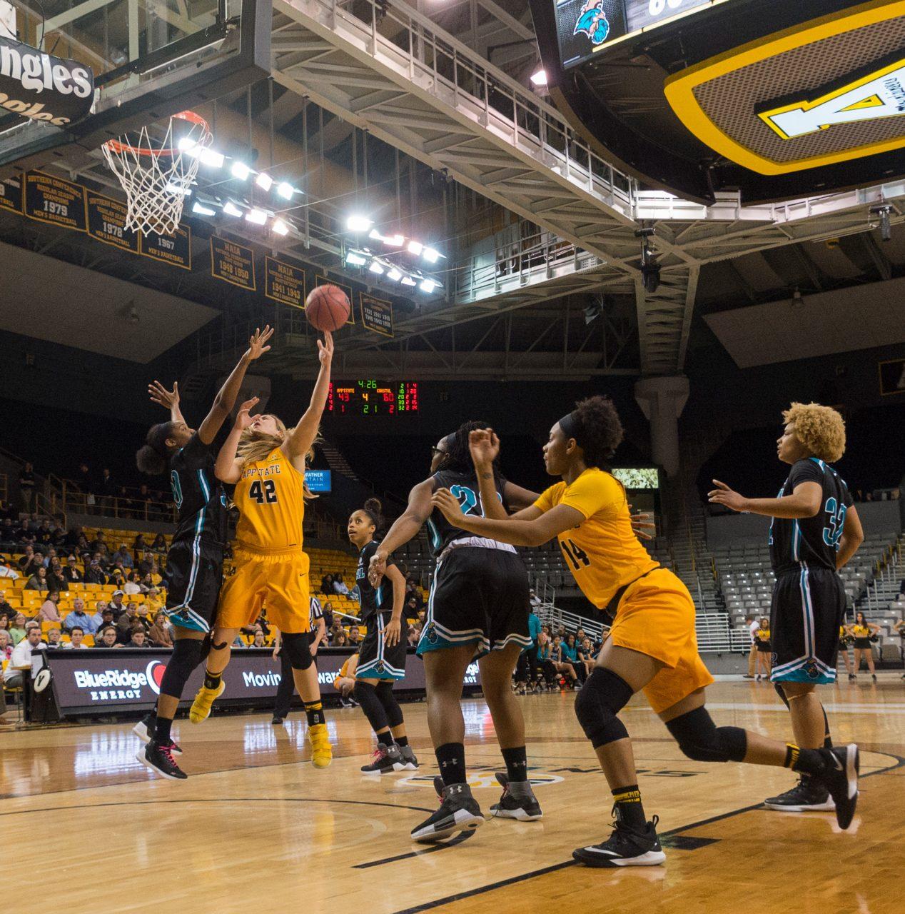 Sophomore center Bayley Plummer shoots and scores two points while teammate Armani Hampton tries to get in position to catch the rebound during the game vs. Coastal Carolina on Saturday, March 3rd. 