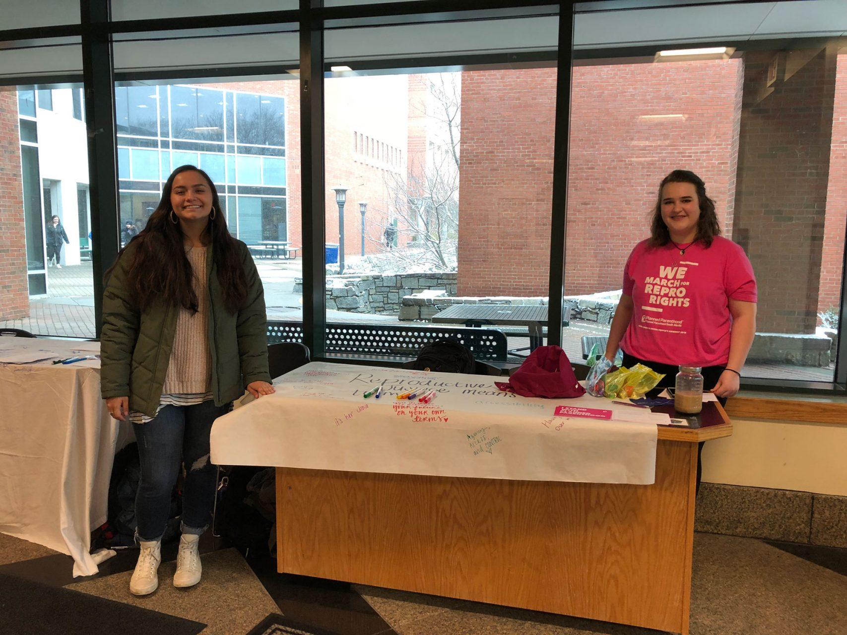 Member Chloe Starr and Event Coordinator Maggie Behm at the Planned Parenthood table in the Student Union. 