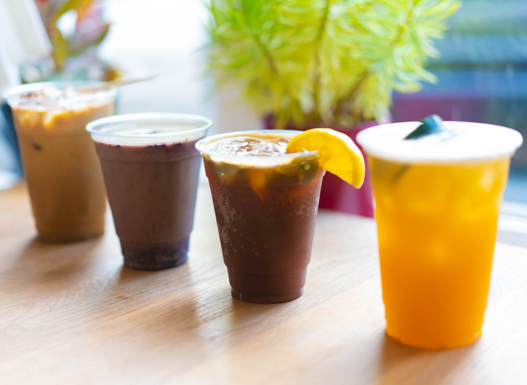Lineup of Hatchet Coffees four specialy drinks from their Summer Menu. From left to right is the Fireside, Blueberry Horchata, Camp Crush Coffee Soda and Porch Swing.