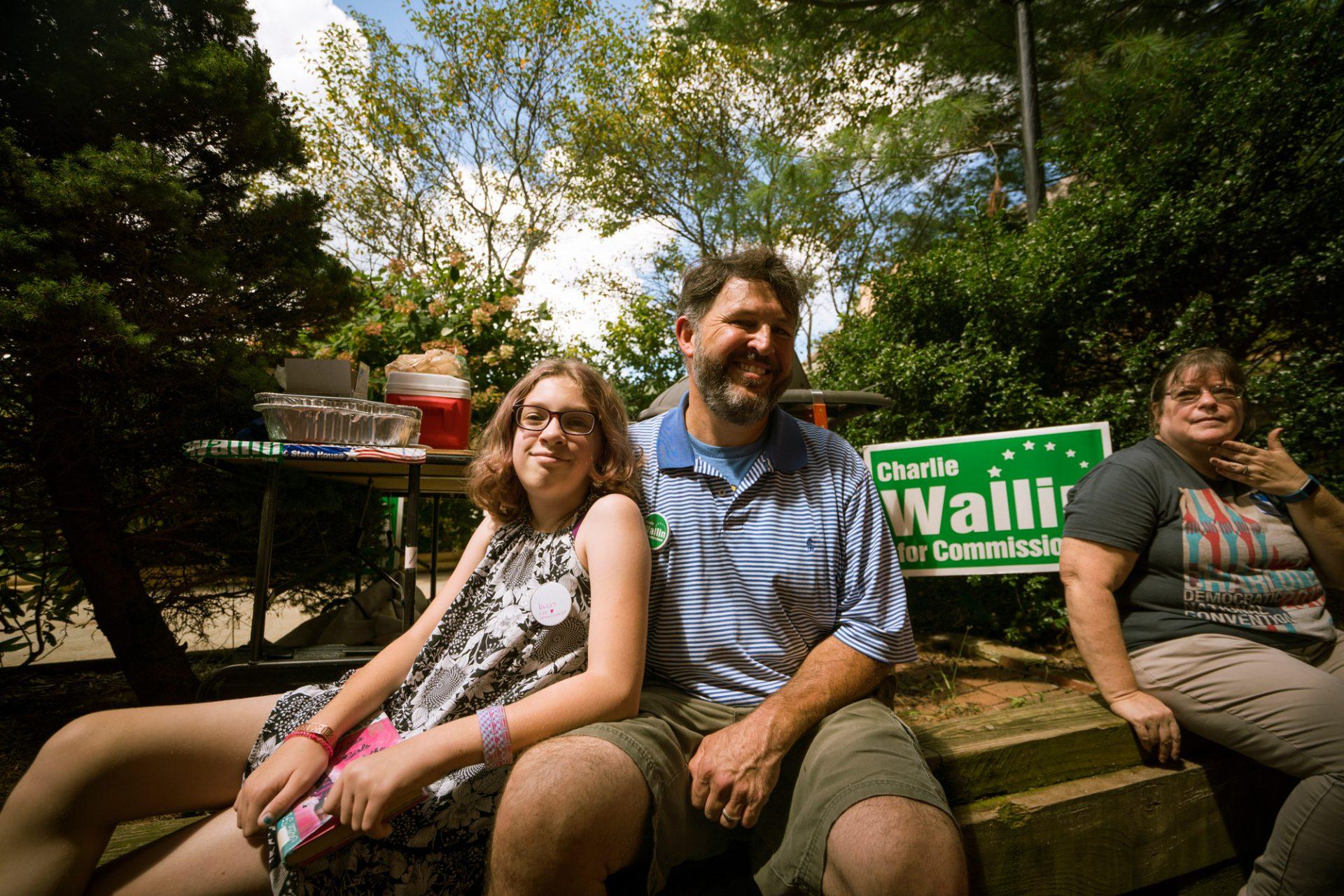 County commissioner candidate and Food Services manager Charlie Wallin with his daughter, who appointed herself campaign education coordinator. Wallin grilled for the Labor Day party as usual, despite having caught on fire while doing so years ago. 