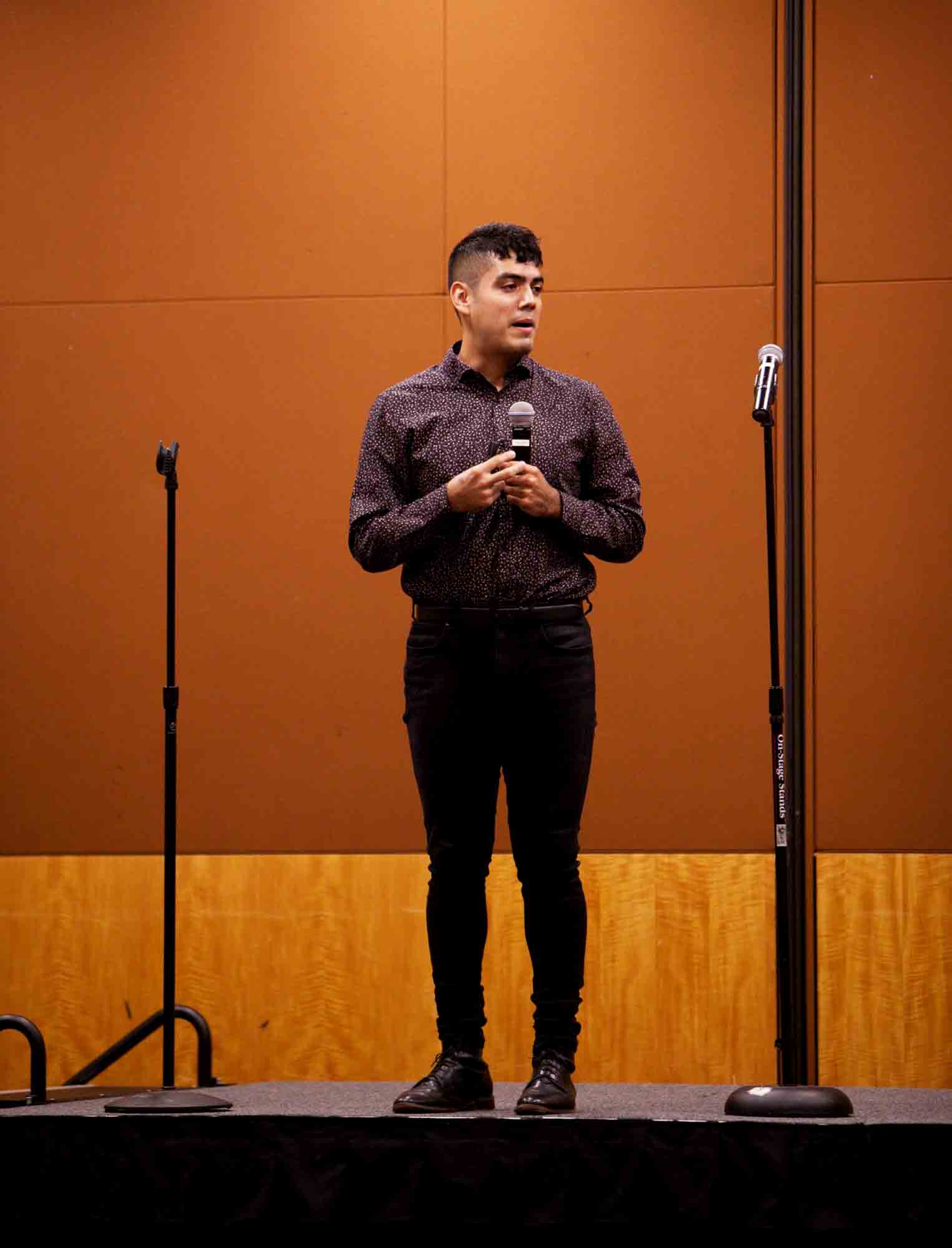 Saul Flores gives a moving speech to the audience at the Hispanic Heritage Festival Wednesday. 