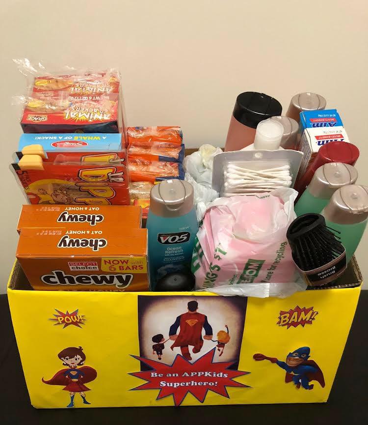 A+box+full+of+donations+for+the+APPKids+Hygeine+and+Snack+Drive.+Acceptable+donations+include+items+like+shampoo%2C+toothpaste+and+snackfoods+for+kids.