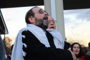  Rabbi Stephen Roberts and Rev. Roy Dobyns sing together at the candlelight vigil in honor of the victims of the synagogue shooting in Pittsburg. 