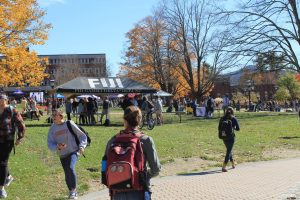 Students walk around Sanford Mall during Fall Fest