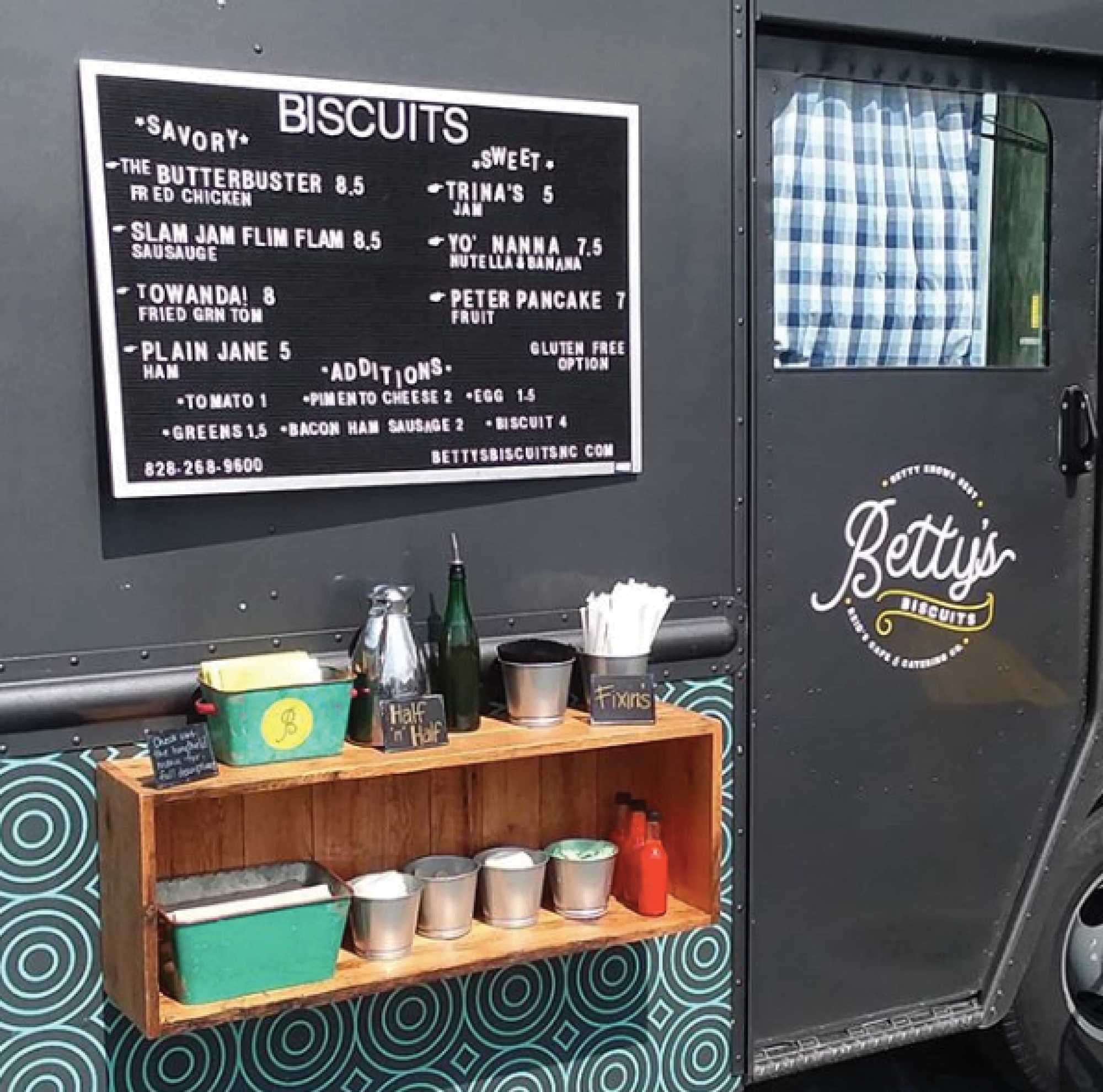 Bettys Biscuits menu displayed on the side of their food truck. Bettys offers savory and sweet biscuits.