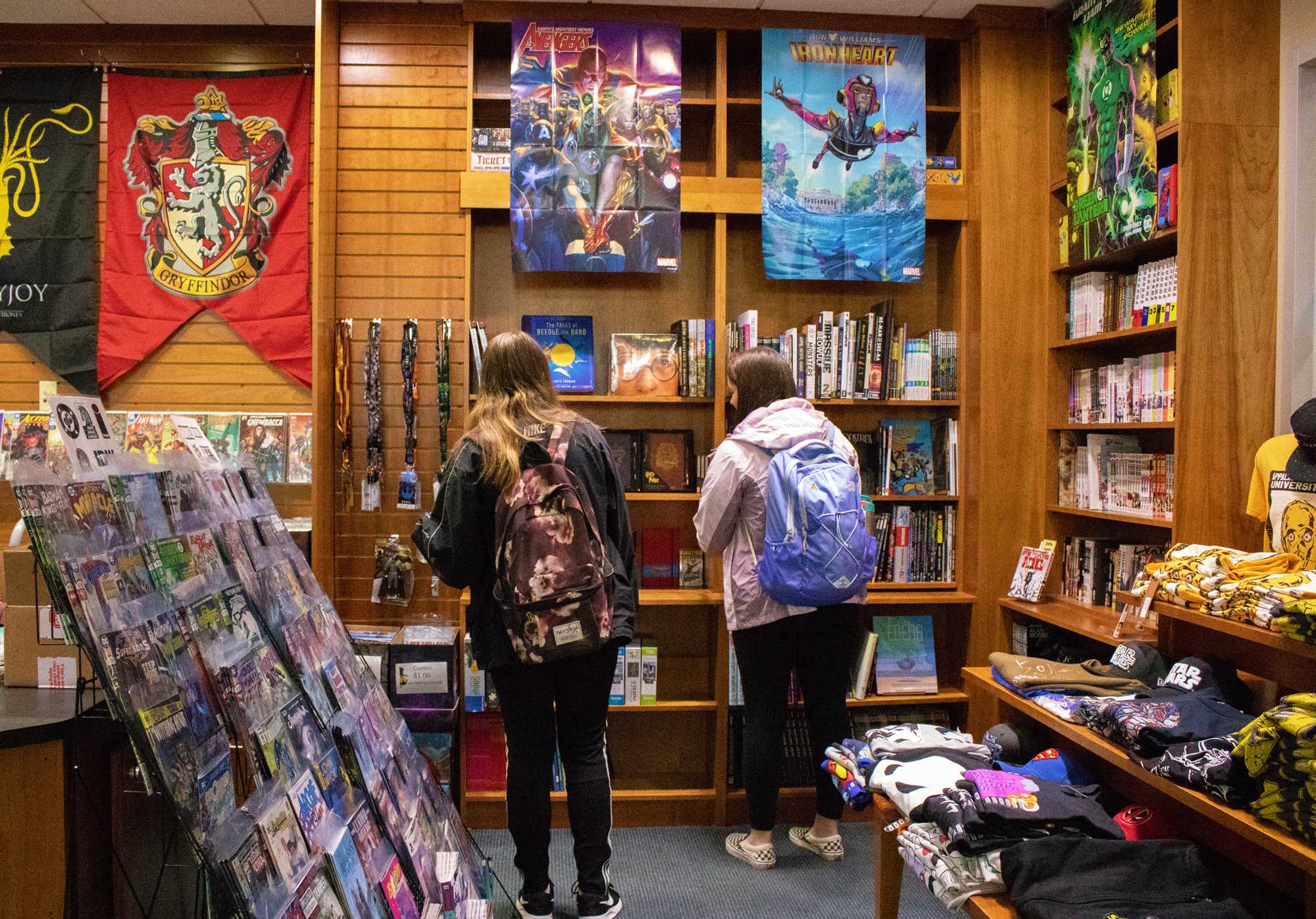 Students+browse+the+comic+book+section+of+the+university+book+store.+The+bookstore%E2%80%99s+new+selection+of+comic+books+range+from+super+hero+stories+like+Black+Panther+to+TV+show+favorites+like+Stranger+things