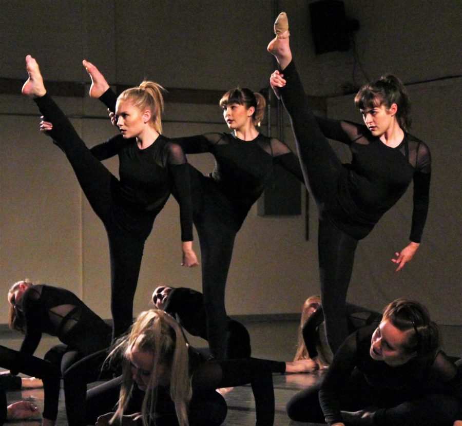 Erin McCarthy (left), Annie Young (middle), and Allie Roberts (right) impress the audience with their flexibility in the piece ‘Copycat’ choreographed by student choreographer, Makayla Canady.