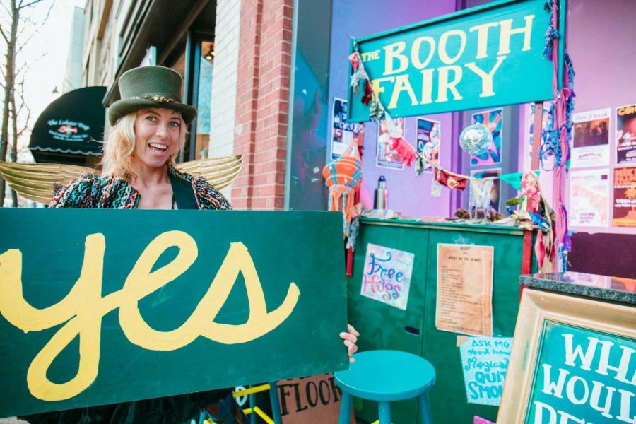 Elle+Erickson+sets+up+her+shop+in+downtown+Asheville.+You+can+find+free+hugs%2C+free+advice%2C+high+fives%2C+dancing+and+more+at+her+traveling+booth+and+thrift+store.+