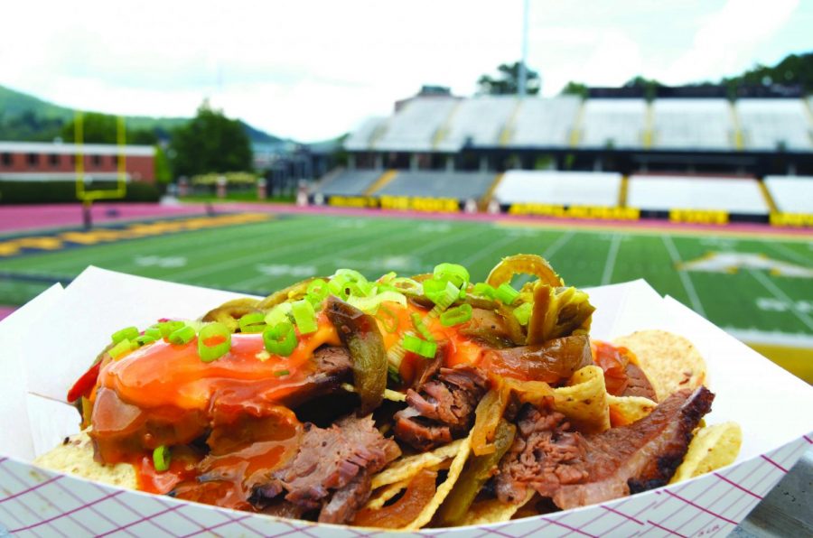 One of the featured dishes is brisket loaded nachos, which will be sold at the Smoke House: Hall of Fame stand. The menu was created by executive chef Tony Bates, who pulled barbecue inspiration from the Deep South. Courtesy of Food Services.