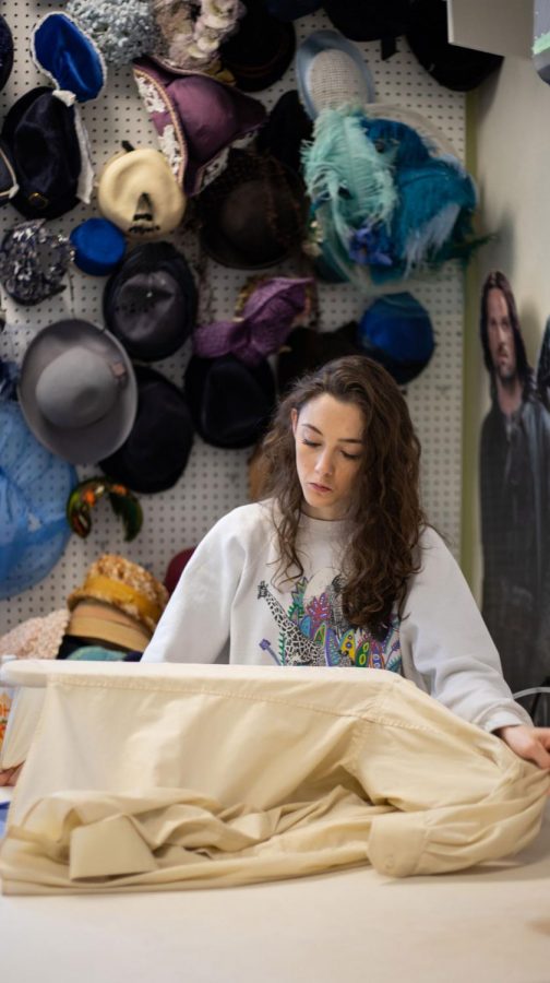 Junior dance studies major Amanda Mason works on a costume design for  the theater departments upcoming production of William Shakespeares A Midsummer Nights Dream. The show opens on April 10th.