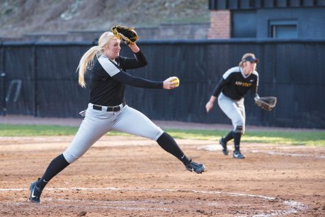 Junior pitcher Kenzi Longanecker winds up and fires to the plate.