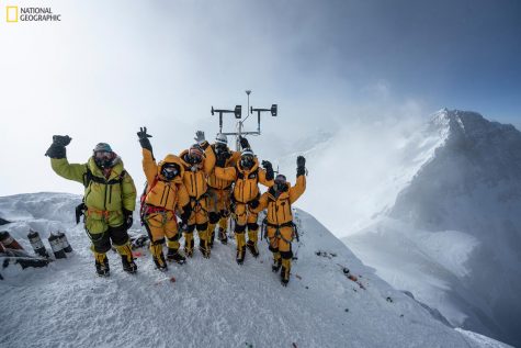 At 8,430 meters above sea level, the high-altitude expedition team celebrates after setting up the worlds highest operating automated weather station during National Geographic and Rolexs 2019 Perpetual Planet Extreme Expedition to Mount Everest. Among them is Appalachian’s Dr. Baker Perry, third from right. Learn more at www.natgeo.com/everest. Photo by Mark Fisher, National Geographic