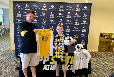 Jacob Brown poses with mens soccer head coach Jason OKeefe after signing with the Mountaineers on August 15. Photo courtesy of App State Athletics