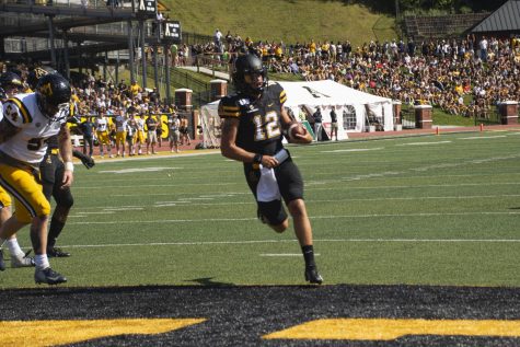 Junior quarterback Zac Thomas scores a touchdown in App States 42-7 win over East Tennessee State on Aug. 31.