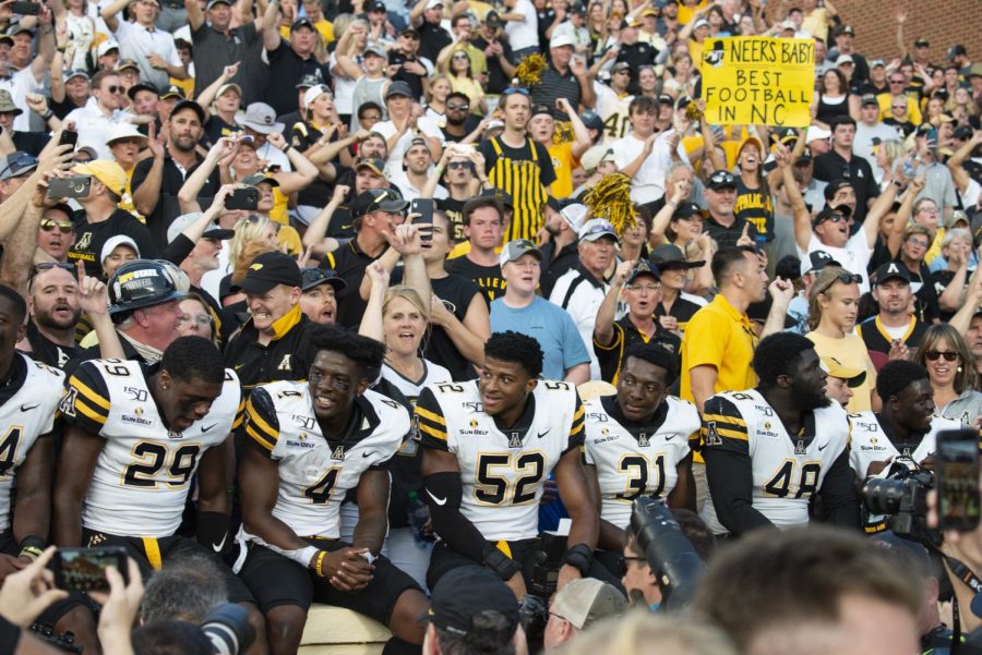 App State players celebrate with fans after last year's win over UNC. Despite a push for the families of players to be allowed, Kidd Brewer Stadium will be empty for at least the first two home games.