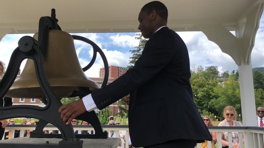 DeJon Milbourne, student body president, rings the Founders Bell at its new home in Founders Plaza.