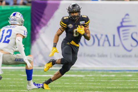 Redshirt freshman Camerun Peoples gets a carry in App States 45-13 win over Middle Tennessee State in last years R+L Carriers New Orleans Bowl. // Photo courtesy of App State Athletics, Jonathon Aguallo