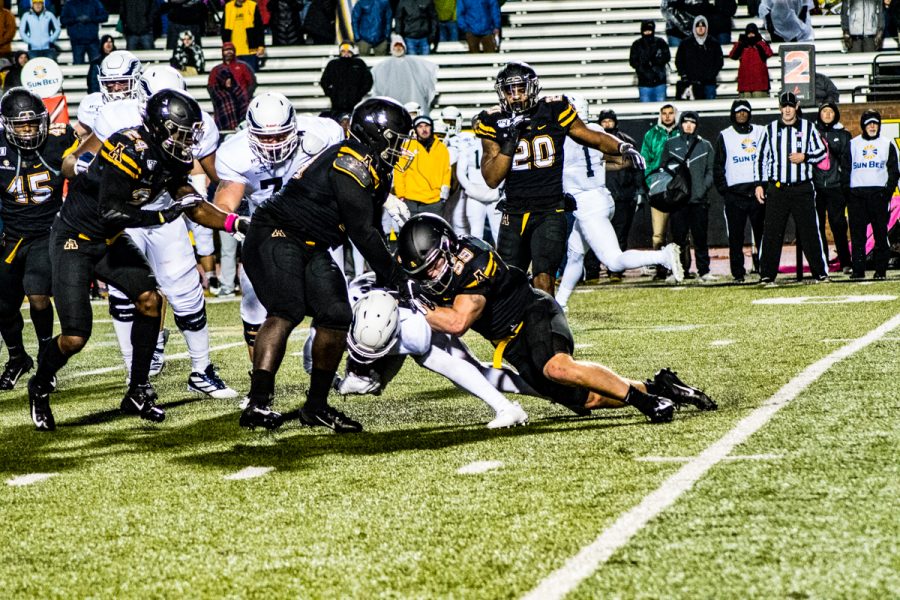 Senior captain and linebacker Jordan Fehr helps make a tackle in App States 24-21 loss to Georgia Southern on Oct. 31.