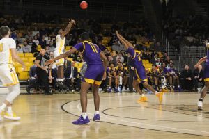 Sophomore guard Adrian Delph knocks down a three pointer in the first half of App States 68-62 win over East Carolina on Nov. 13. Delph set new career-highs with 19 points and nine rebounds in the game.