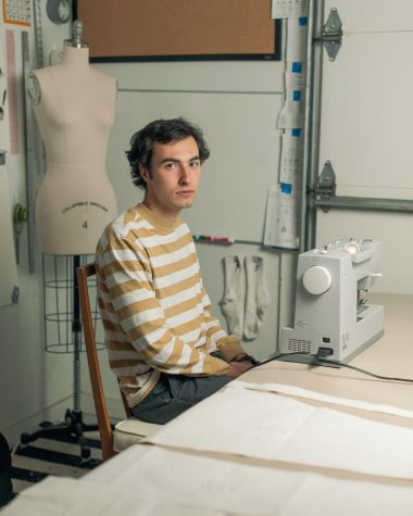Austin Juno, an apperal design major, sits in his home studio in Boone. He started his fashion brand, Juno in high school as a form of artistic expression and an outlet from his small town.