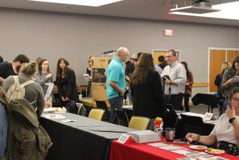 Students gather around many different tables and stations at the Study Abroad Fair to learn about international education opportunities at App State.  