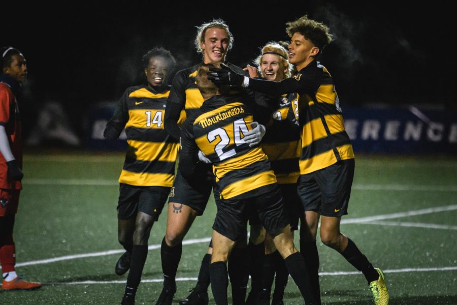 Members of App States soccer team celebrate after a goal from junior midfielder/forward Marc Pfrogner (#24). 
