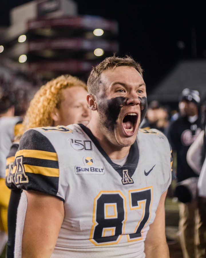Senior tight end Collin Reed celebrates the 5-point victory over his hometown team on Nov. 11