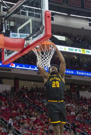 Sophomore guard Adrian Delph dunks in App State's loss at NC State on Dec. 29. Delph recorded his first career double double in the loss to Georgia State on Thursday.