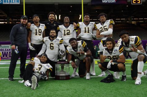 Members of the App State defense celebrate the victory against UAB at the New Orleans Bowl Dec. 21.
