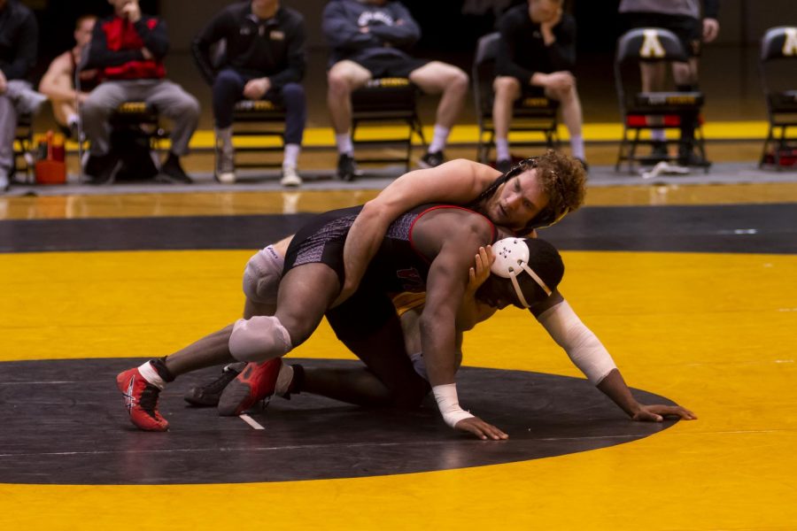 Junior Thomas Flitz grapples with an opponent from VMI on Feb. 23. Flitz and the Mountaineers will host the SoCon championships at the Holmes Convocation Center on Sunday, March 8.
