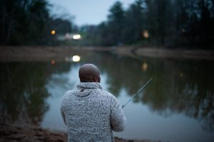 James Murdock of Granite Falls fishes as the sun sets in Caldwell County. “I’m not gonna let anything stop me from fishing. I love to fish,” he said.